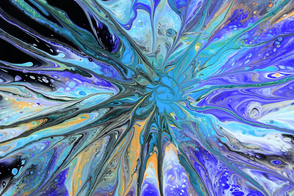 Colorful abstract acrylic pour painting with swirling patterns and vibrant colors.